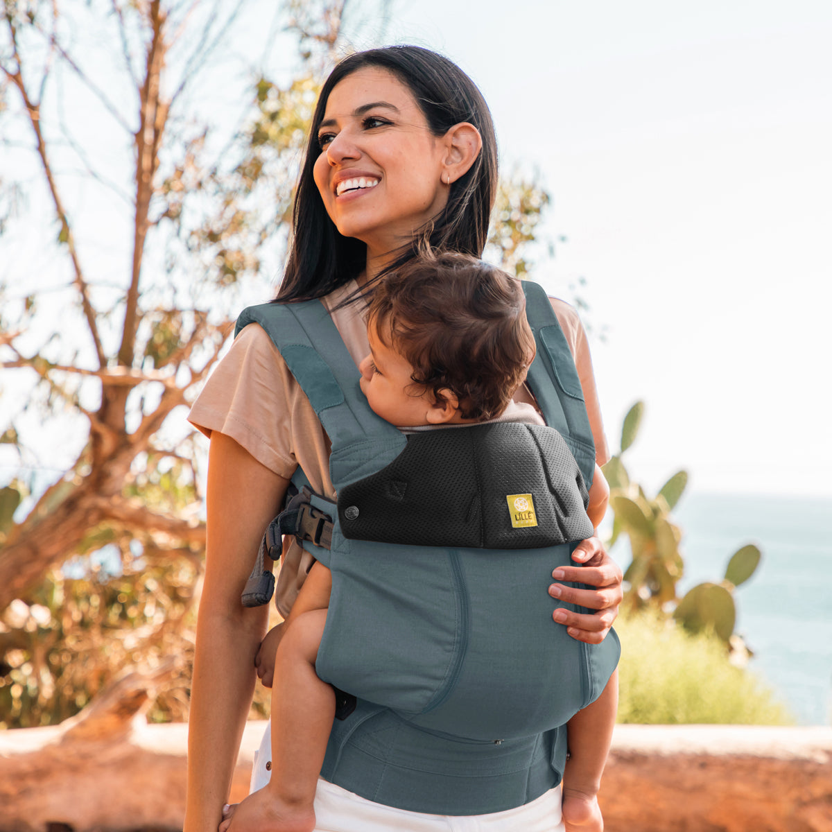 mom wearing baby in Complete 6-in-1 All Seasons in Cypress