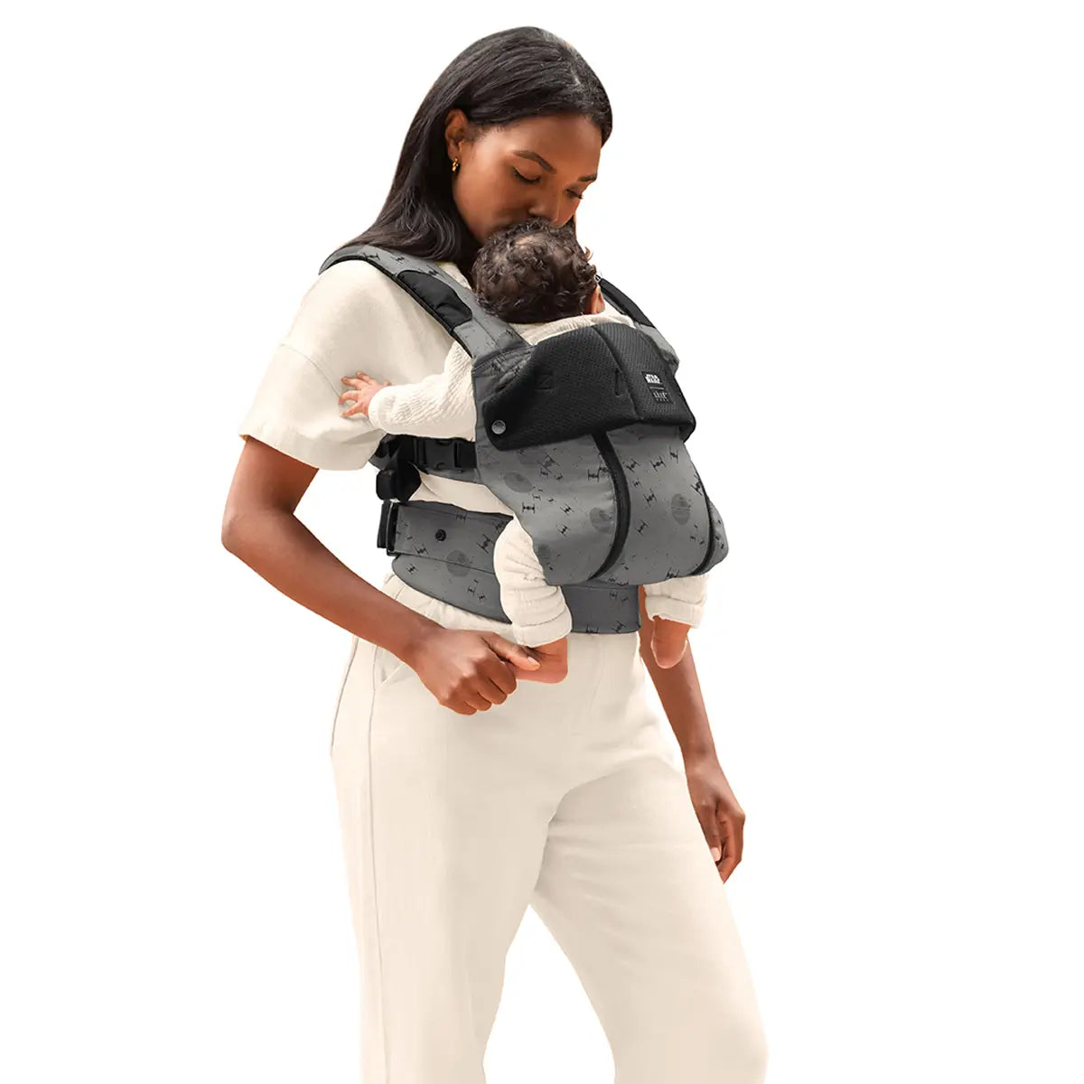 mom wearing baby in complete all seasons carrier in galactic icons